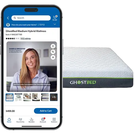 The image shows a smartphone displaying an online product page for a GhostBed Medium Hybrid Mattress alongside a GhostBed mattress. The phone screen features a woman speaking in a video review, product details, star ratings, and a price of $499.00. The mattress on the right has a white textured surface with a dark side panel and the GhostBed name clearly visible. The overall scene emphasizes digital shopping for bedding products and customer reviews.